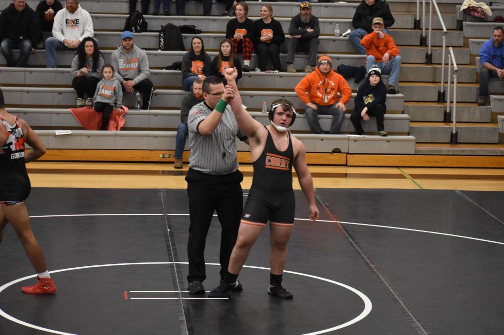 Kael+Albers+gets+his+hand+raised+after+pinning+Bishop+McCort+opponent