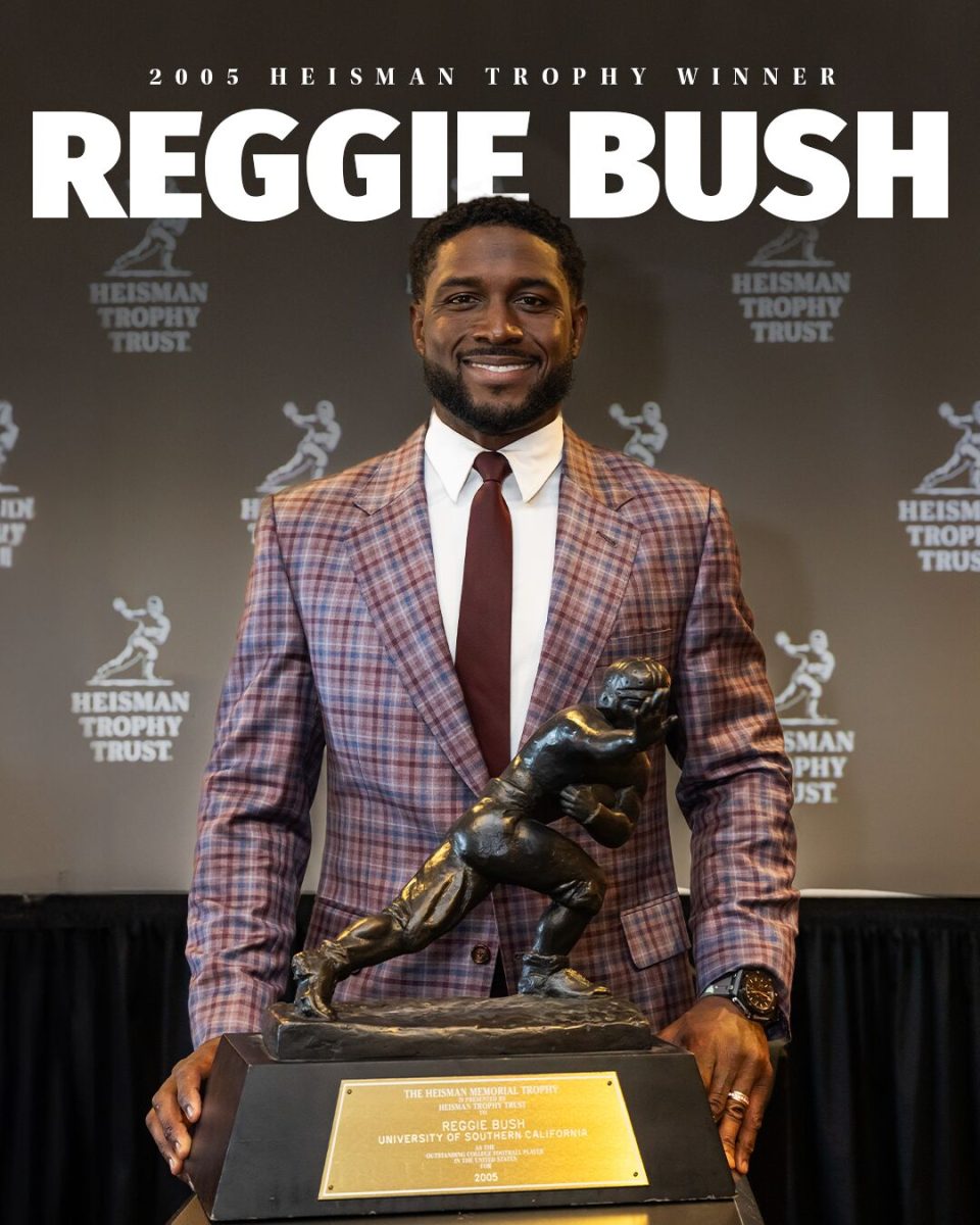 Reggie+Bush+gets+his+Heisman+back