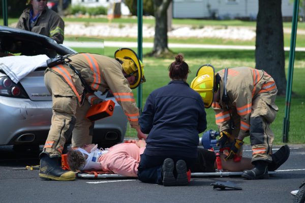 Luke Hurd being strapped to a stretcher after collapsing during the mock crash