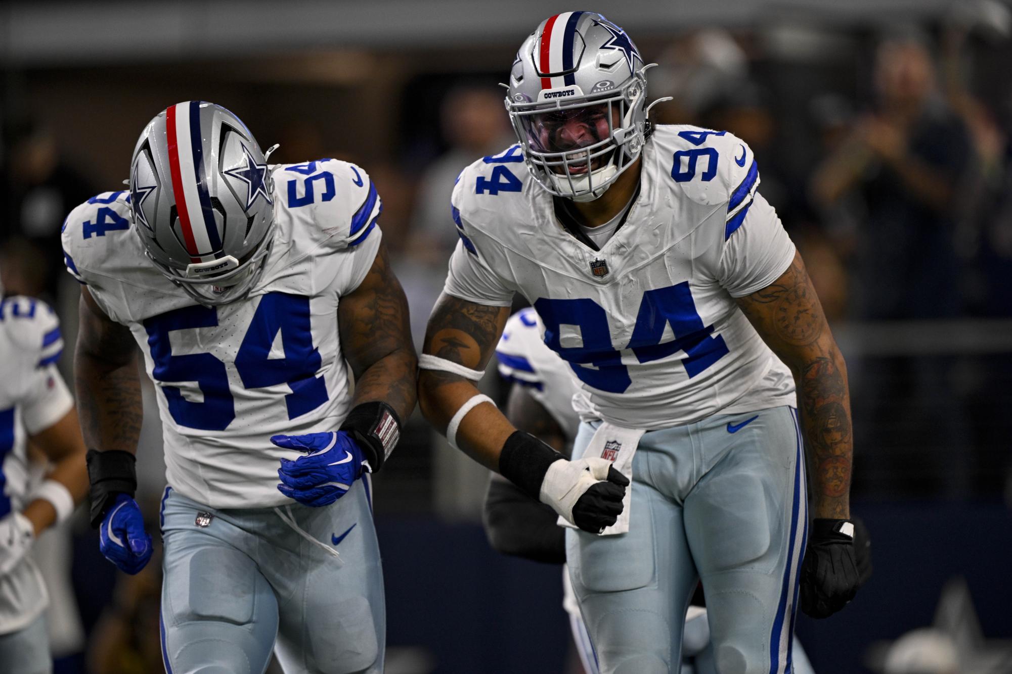 Nov 3, 2025; Arlington, Texas, USA; Dallas Cowboys defensive end Marshawn Kneeland (94) and defensive end Sam Williams (54) celebrates after returning a blocked punt for a touchdown during the game between the Dallas Cowboys and the Arizona Cardinals at AT&T Stadium. Mandatory Credit: Jerome Miron-Imagn Images