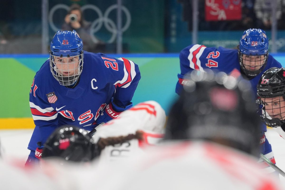 Feb 19, 2026; Milan, Italy; Hilary Knight (21) of the United States looks on during a face off in the women's ice hockey gold medal game against Canada during the Milano Cortina 2026 Olympic Winter Games at Milano Santagiulia Ice Hockey Arena. Mandatory Credit: Amber Searls-Imagn Images