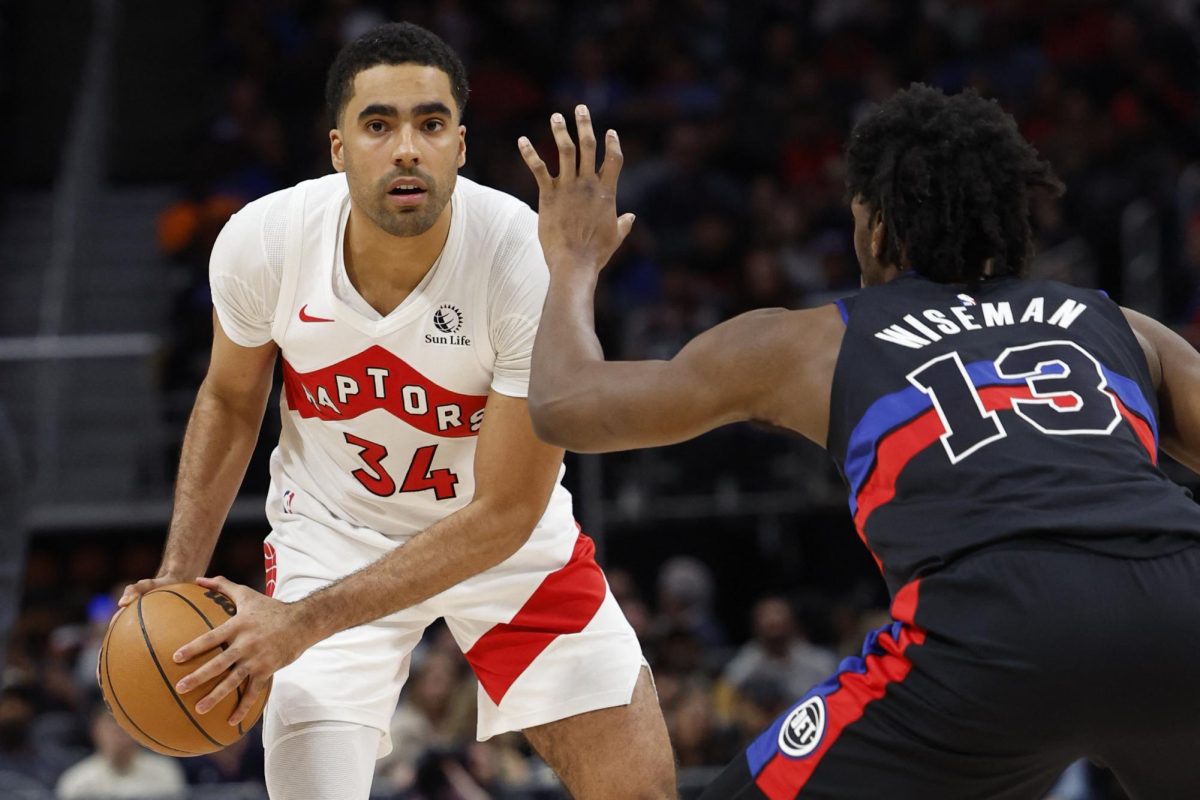 Mar 13, 2024; Detroit, Michigan, USA;  Toronto Raptors center Jontay Porter (34) is defended by Detroit Pistons center James Wiseman (13) in the second half at Little Caesars Arena. Mandatory Credit: Rick Osentoski-USA TODAY Sports/ File Photo