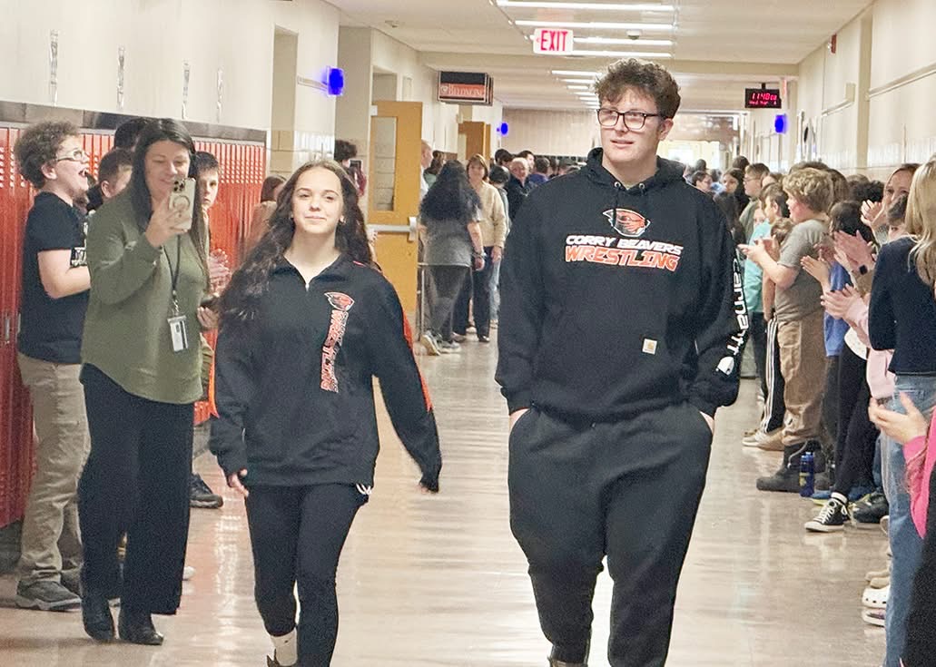 Finley Fourspring and Owen Nickerson walking the halls for a send off to states