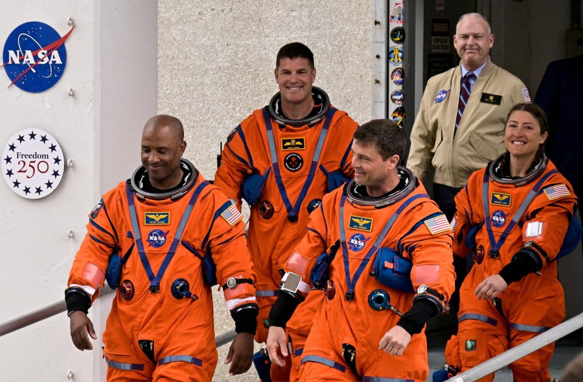 The crew of the Artemis II launch mission to fly by the moon, NASA astronauts Reid Wiseman, Victor Glover and Christina Koch and CSA (Canadian Space Agency) astronaut Jeremy Hansen, walk to board the astronaut van for their drive to launch pad 39B at the Kennedy Space Centre in Cape Canaveral, Florida, U.S., April 1, 2026.  REUTERS/Steve Nesius